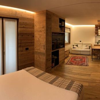 Riqualificazione e trasformazione in appartamento ad elevata efficienza energetica di locale adibito a portineria all'interno di condominio