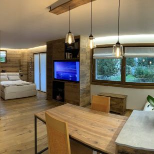 Riqualificazione e trasformazione in appartamento ad elevata efficienza energetica di locale adibito a portineria all'interno di condominio